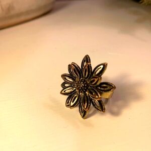 Flower ring black outline on dark gold colour size 7